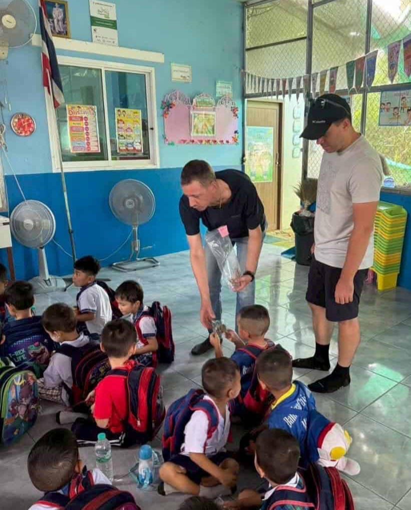 two volunteers on volunteer visa in chiang mai donating cookies to orphans two volunteers on volunteer visa in chiang mai donating cookies to orphans